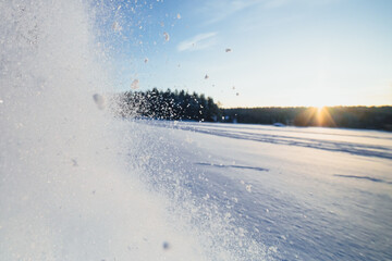 Wall Mural - snow splash in the air, blue sky background