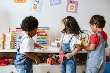 Young children playing with educational toys