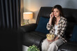 © geargodz - sad woman watching television and crying on sofa at night