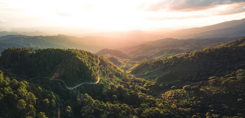 Wall Mural - Panorama mountain road into a rural village form above