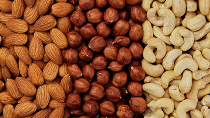Wall Mural - Different types of nuts. Assorted nuts cashews, almonds, hazelnuts top view