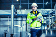 © Quality Stock Arts - Factory worker engineer working in factory using tablet computer to check maintenance boiler water pipe in factory.