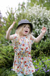 © triocean - Active little toddler girl running and jumping in the park