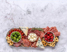 Italian Antipasti Or Charcuterie Board. Assortments Of Meat And Cheese Snacks.