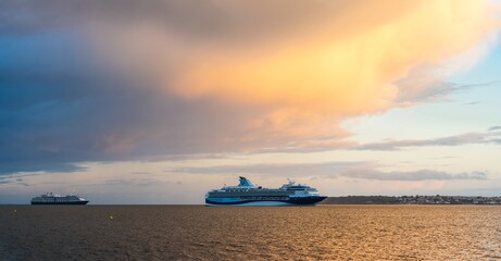 Wall Mural - Sunset over Cruise ferries in Torquay, Devon, England, Europe