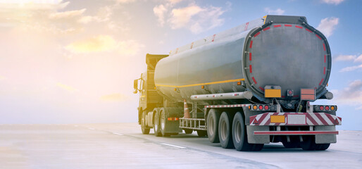 Wall Mural - Gas Truck on highway road with tank oil  container, transportation concept.,import,export logistic industrial Transporting Land transport on the expressway with blue sky.image motion blur