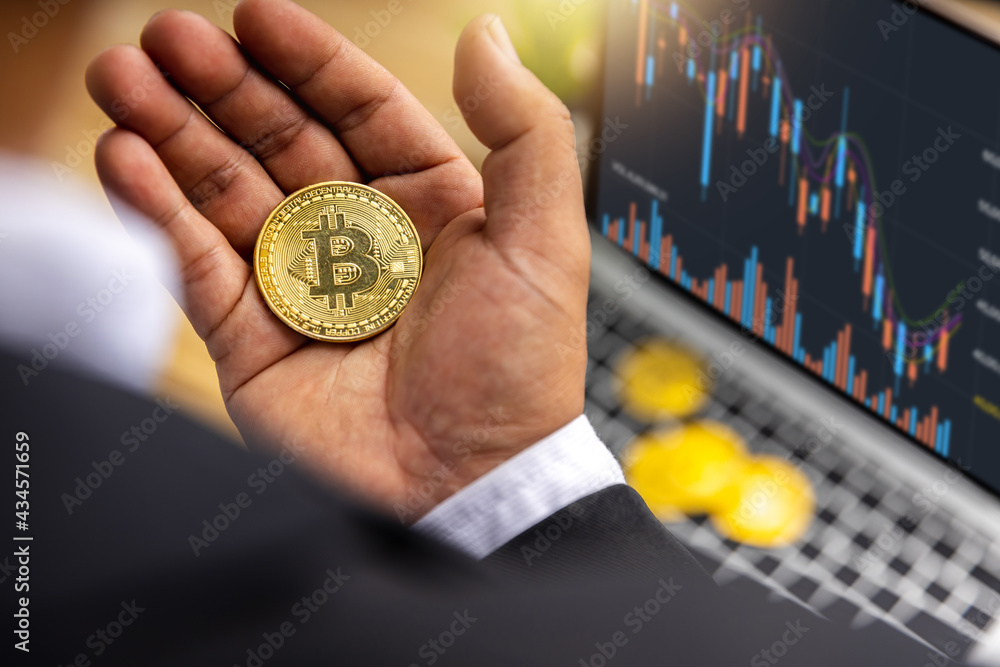 Close up bitcoin in hand of businessman trader holding cryptocurrency profit and income from investing in stock to exchange crypto and pay to buy in financial technology market, investor in e-commerce