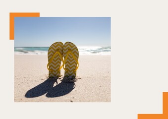 Wall Mural - Composition of photograph with flip flops on beach and copy space on beige background