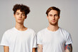 © SHOTPRIME STUDIO - two friends in white t-shirts fun emotions isolated background