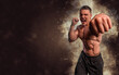 © Артур Парфененко - Energy and power boxing concept. Sports advertising. fighting muscular man in smoke on dark background. Athlete muscular brutal bodybuilder emotional posing