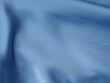 © tenkende - Blue satin texture background with waves and crease
