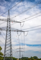 High voltage electric pole and transmission lines. Electricity pylons. Power and energy engineering system. Cable wire on an electric post.