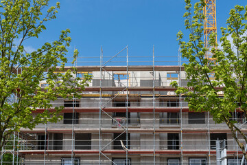 Wall Mural - building under construction, facade with scaffolding