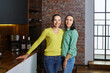 © grigvovan - Middle class family in kitchen of loft apartment, two elegant sisters of about 40.