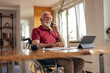 © bnenin - Disabled old man, making a business deal, at home office.