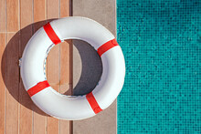 Top View Of Lifebuoy Lying Near The Swimming Pool