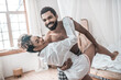 © zinkevych - Attractive african american hugging woman in dance movement