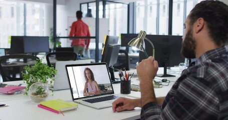 Poster - Middle eastern man talking on video call with female office colleague on laptop at office