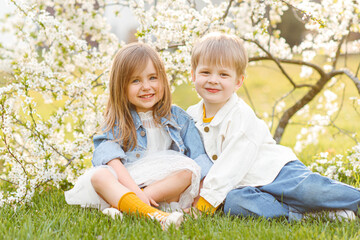 portrait of two children in the spring in nature