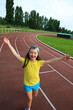 © denys_kuvaiev - Little girl have fun on the stadium