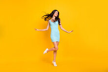 Photo Of Cheerful Dreamy Lady Closed Eyes Stand Tiptoe Wear Blue Dress Footwear Isolated Yellow Color Background