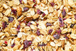 Close up of texture of granola with cranberries and no sugar. Healthy lifestyle and breakfast concept. Vegan and Vegetarian