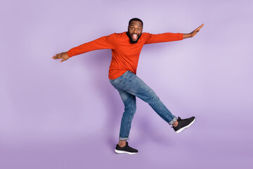 Poster - Full length body size view of attractive cheerful funky guy dancing having fun isolated over violet purple pastel color background