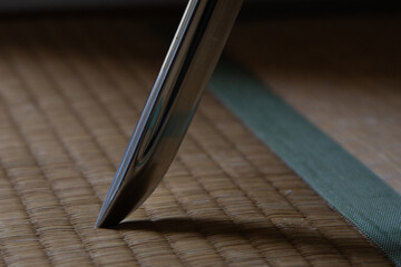 Poster - Closeup shot of a sharp knife on a wooden surface