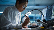 © Gorodenkoff - Modern Electronics Facility: Beautiful Black Female Scientist, Engineer Does Printed Curcuit Motherboard Soldering. Does Design, Development of Industrial PCB, Silicon Microchips, Semiconductors