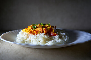 Boiled rice with baked vegetables mixed with coconut sauce