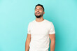 © luismolinero - Young arab man isolated on blue background laughing