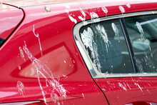 Dirty Red Car Surface With Lot Of Bird Pigeon Droppings. Dirty Place Concept