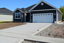 New Home Driveway Construction With A Concrete Cement Foundation By Builders For A Smooth Surface