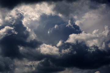 Wall Mural - stormy cumulus clouds view. dramatic sky before a thunderstorm. dark ominous low clouds. cloudy gloo