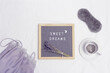 Healthy night sleep concept, cup of lavender tea, pajamas, mask, aromas for better falling asleep, wishing sweet dreams