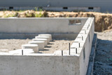 Fototapeta Desenie - New Home Foundation Construction - Concrete with Rebar in Suburban Residential Development