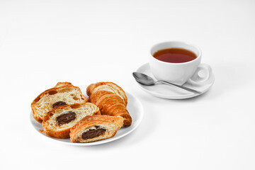 morning tea party. English Afternoon Tea. tea with croissants. light snack between meals. croissant with chocolate on a white background mockup