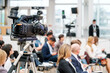 © Anton Gvozdikov - Crop videographer recording video during business seminar
