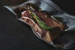 Vacuum packed meat, steak. Sous-vide, new technology cuisine.
