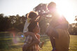 © liderina - African American family having fun outdoors.