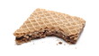 Hazelnut chocolate wafer slice, bar bitten in half with crumbs isolated on white background