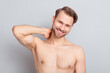 © deagreez - Photo of sexy blond hairdo guy touch neck without clothes isolated on grey color background