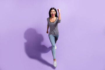 Wall Mural - full size photo of young happy positive smiling woman running fast speed in air isolated on purple c