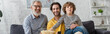 © LIGHTFIELD STUDIOS - Smiling man holding popcorn near son and kid during movie, banner