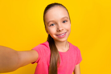 Poster - Photo of girl making selfie toothy smile enjoy free time weekend isolated on yellow color background