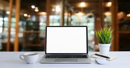 front view of open laptop computer notebook with blank monitor white screen display on work table de