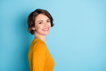 Poster - Profile portrait of nice optimistic brunette lady wear yellow shirt isolated in vivid blue color background