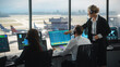 © Gorodenkoff - Female and Male Air Traffic Controllers with Headsets Talk in Airport Tower. Office Room is Full of Desktop Computer Displays with Navigation Screens, Airplane Departure and Arrival Data for the Team.