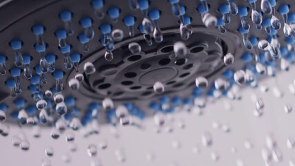 Wall Mural - Drops of clear water dripping from the shower head. Super slow motion shot. Shower head in bathroom close up