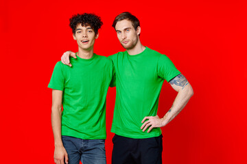 Cheerful friends green t-shirts emotions communication hug friendship